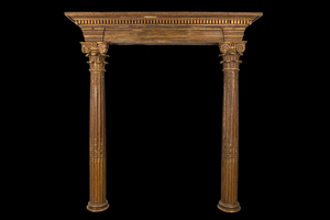 A partly gilt wooden portal with two columns with Ionic capitals, 18/19th C.