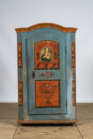 A German polychrome painted single door linen cupboard, dated 1853