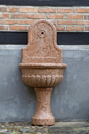 A baroque 'Rosso Verona' marble wall fountain, Northern Italy, 18th C.