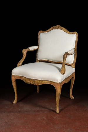 A French patinated wooden Louis XV armchair, 18th C.