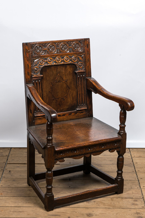 An inlaid carved oak chair with a Star of David, 17th C.