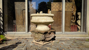 A white stone garden urn and a capital, 19/20th C.