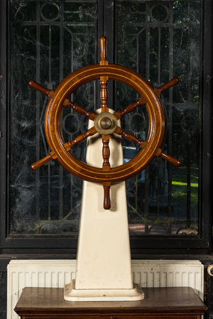 A wooden steering wheel of a boat, 20th C.