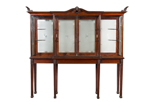 A neoclassical mahogany shop display cabinet with etched glass backdrops, England, ca. 1900