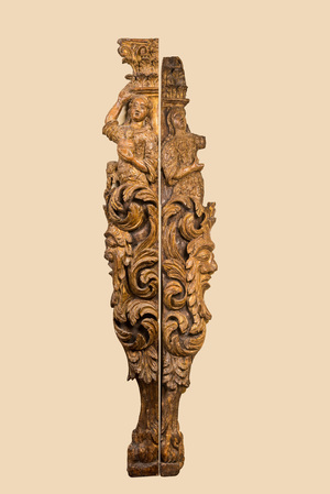 A pair of large gilt wooden reliefs of column fragments with mascarons, 17th C.