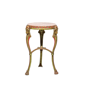 A round polychrome cast iron side table with mascarons and marble top, ca. 1900