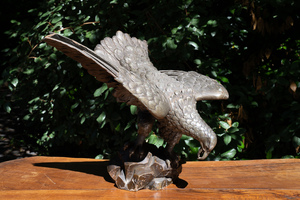 A patinated wood sculpture of an American eagle, 19/20th C.