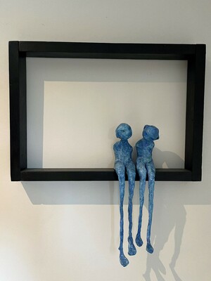 Marieke Nuijens: 'Two children', coloured and baked paper mache in wooden frame