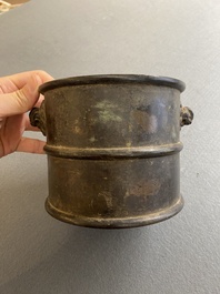A Chinese bronze censer with mythical beast head handles, Xuande mark, Kangxi