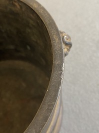 A Chinese bronze censer with mythical beast head handles, Xuande mark, Kangxi