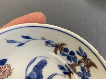 A pair of Chinese blue, white and copper-red semi-eggshell bowls, Xuande mark, Wanli