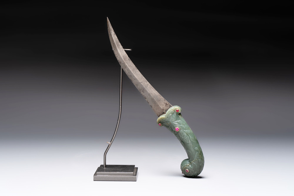 A fine Mughal dagger with a ruby- and gold-inlaid celadon jade hilt, 18th C.
